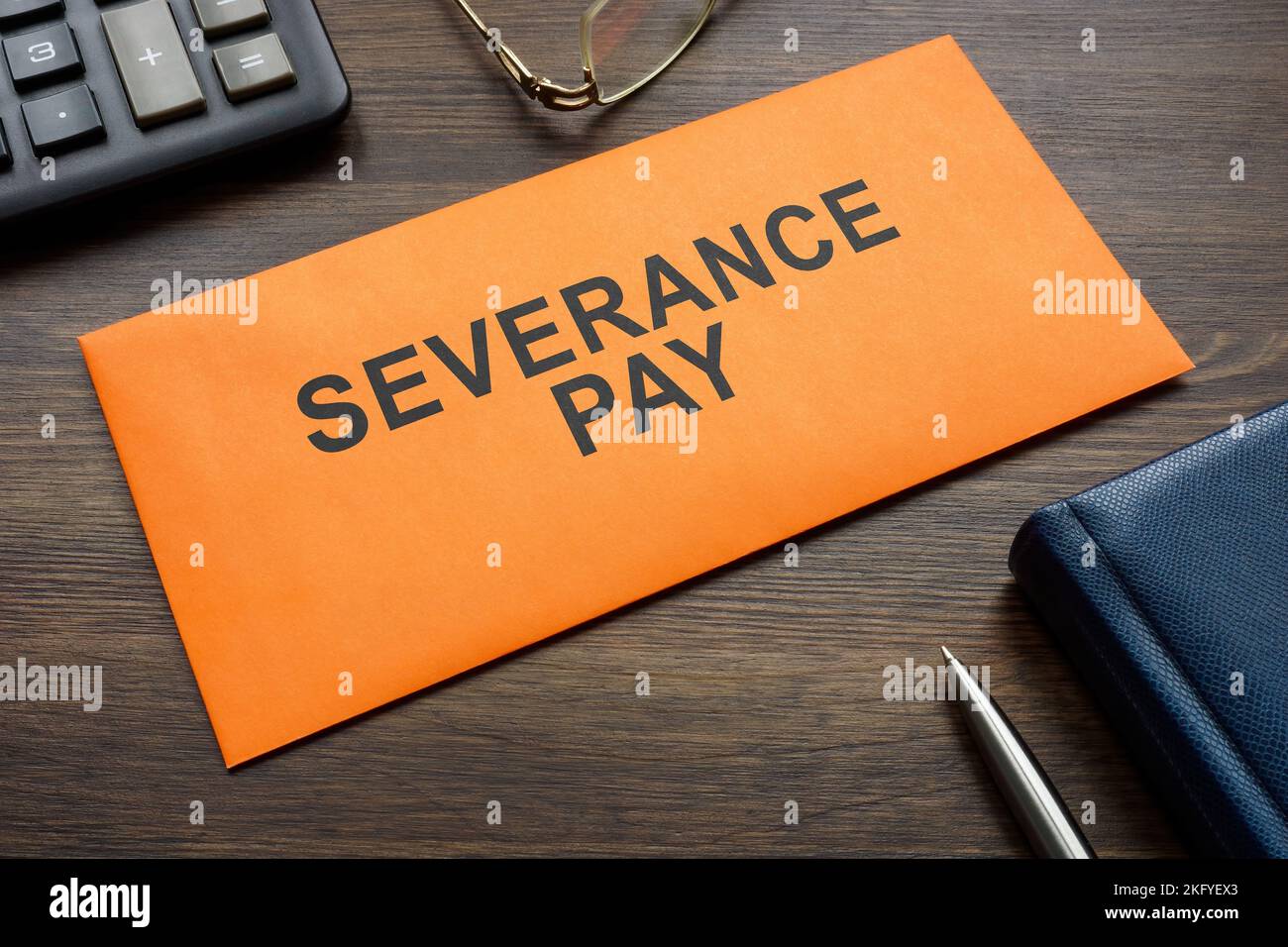 Envelope with sign severance pay on the desk Stock Photo Alamy