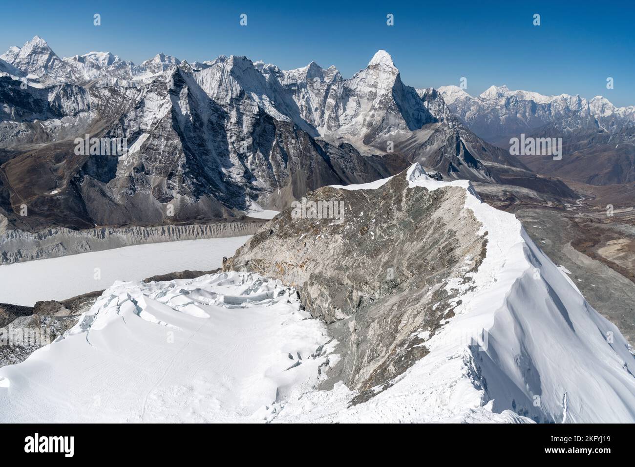 Daylight view of Mount Everest, Lhotse and Nuptse and the rest of Himalayan range from air. Sagarmatha National Park, Khumbu valley, Nepal. Mountain Stock Photo