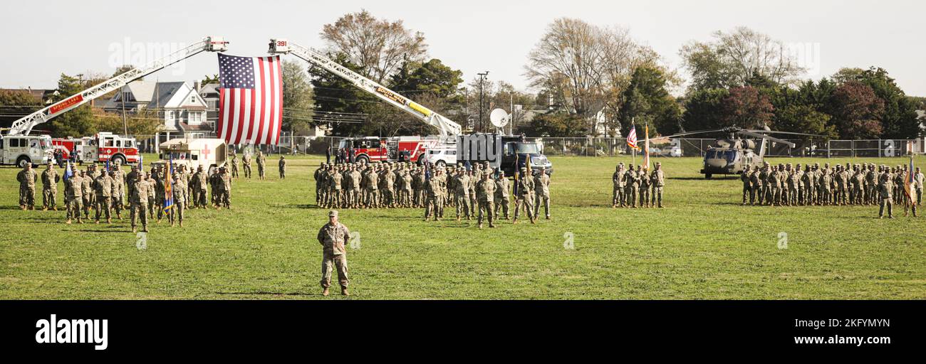 New Jersey National Guard Soldiers and Airmen stand at the position of