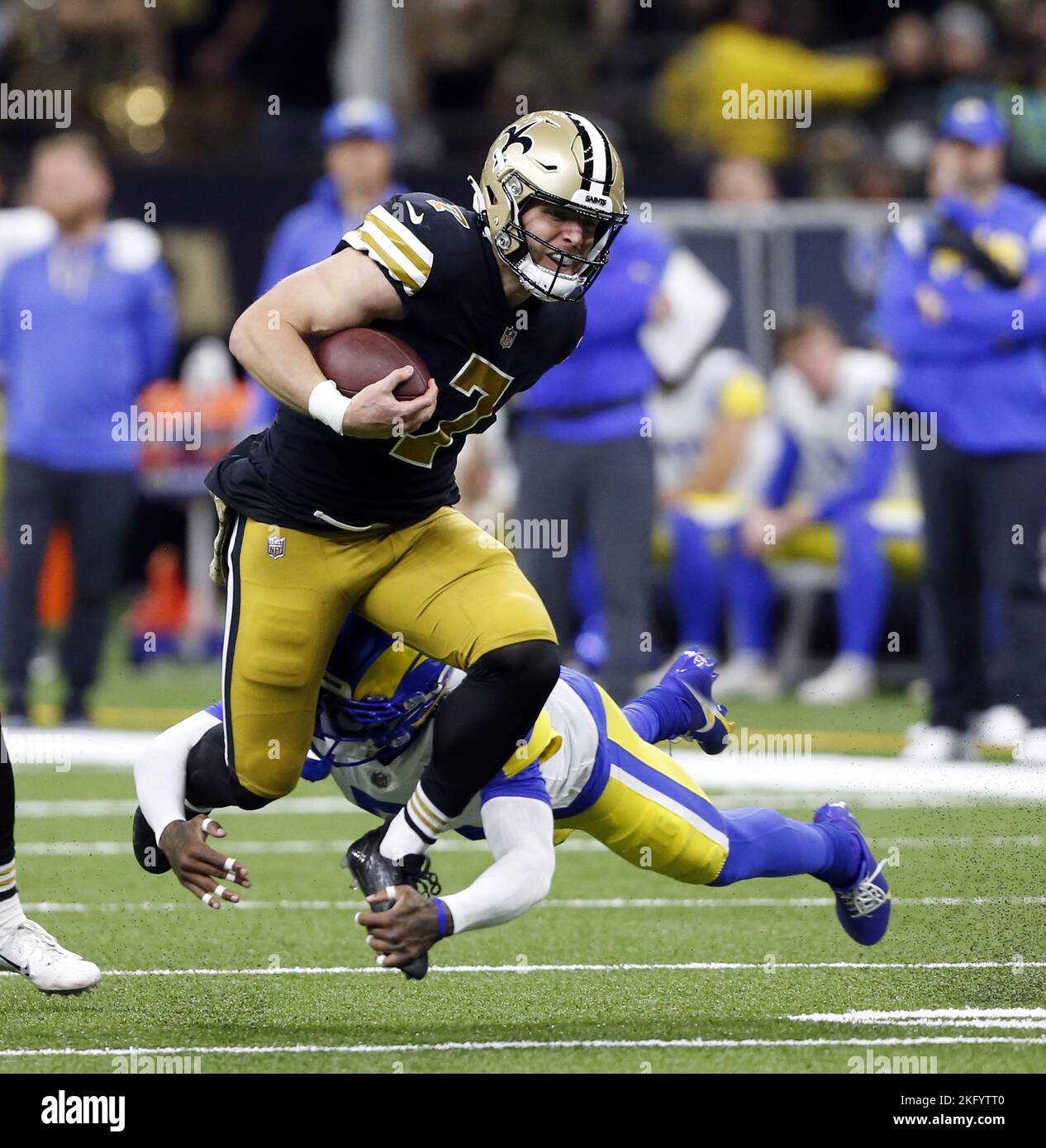 New Orleans, United States. 21st Nov, 2022. New Orleans Saints tight end Taysom Hill (7) is tripped up by Los Angeles Rams cornerback Jalen Ramsey (5) at the Caesars Superdome in New Orleans on Sunday, November 20, 2022. Photo by AJ Sisco/UPI. Credit: UPI/Alamy Live News Stock Photo