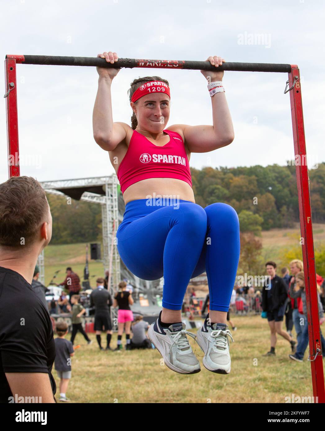 A "Spartan" exerts effort doing pullups during the Nashville Spartan