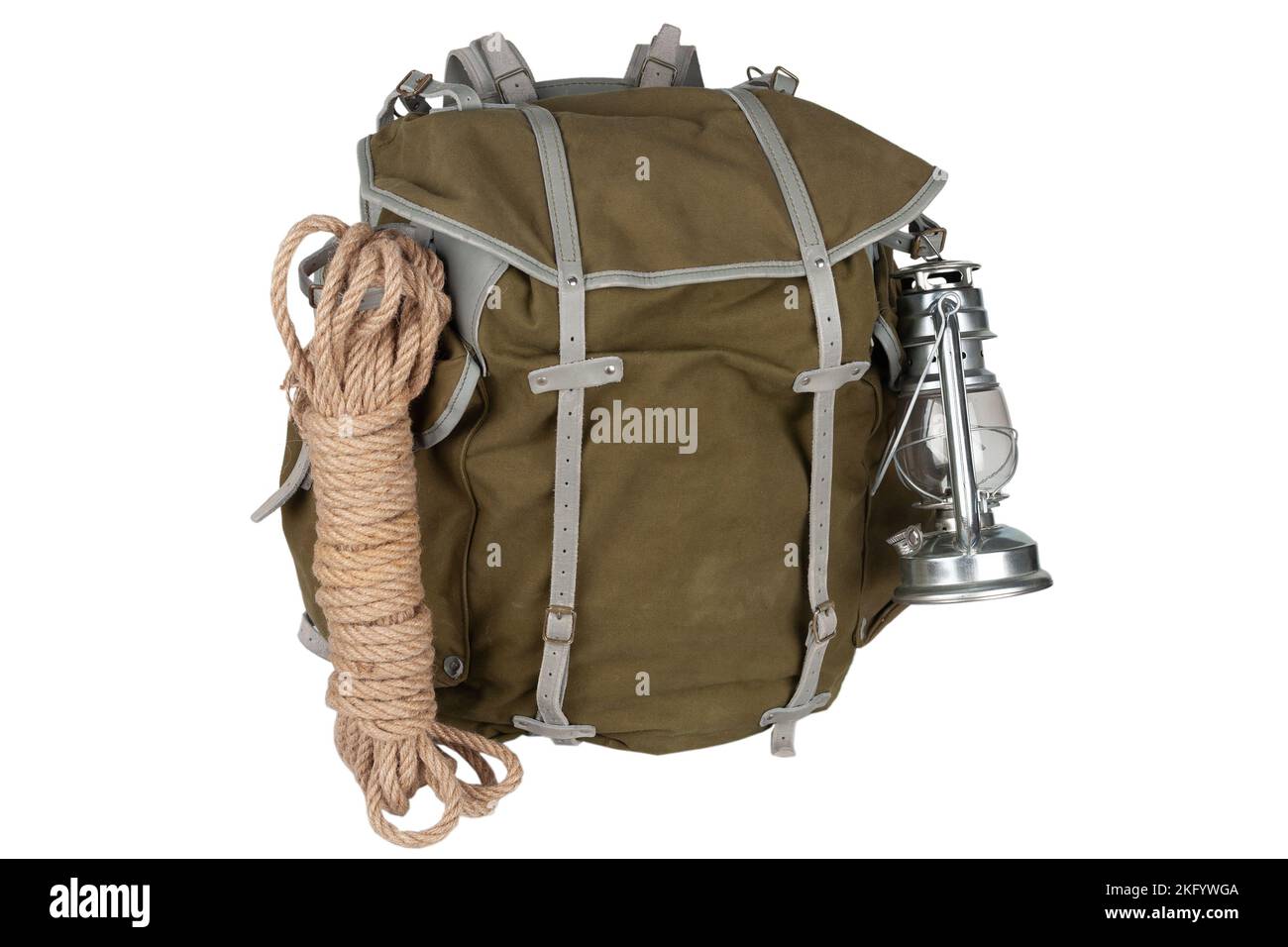 Antique vintage backpack with rope, teapot, brass mug and gas lantern