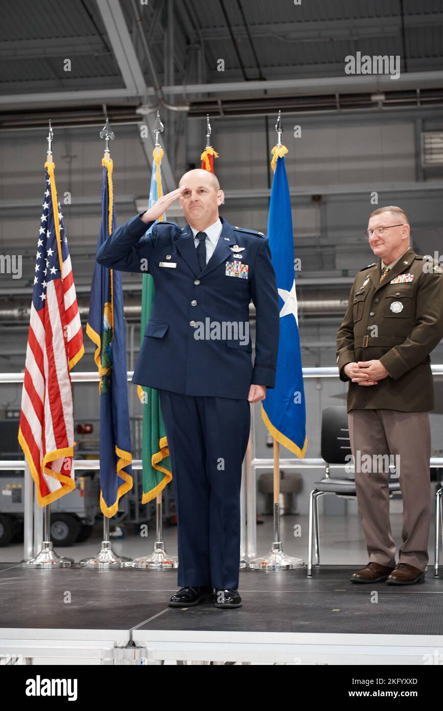 Col. David Shevchik, the outgoing commander of the Vermont Air National Guard's 158th Fighter Wing, salutes the Airmen of the wing for the final time before handing over command during a ceremony, Vermont Air National Guard Base, South Burlington, Vermont, Oct. 16, 2022. Col. Daniel Finnegan, the vice wing commander, took over command of the wing from Shevchik who commanded for three years. Stock Photo