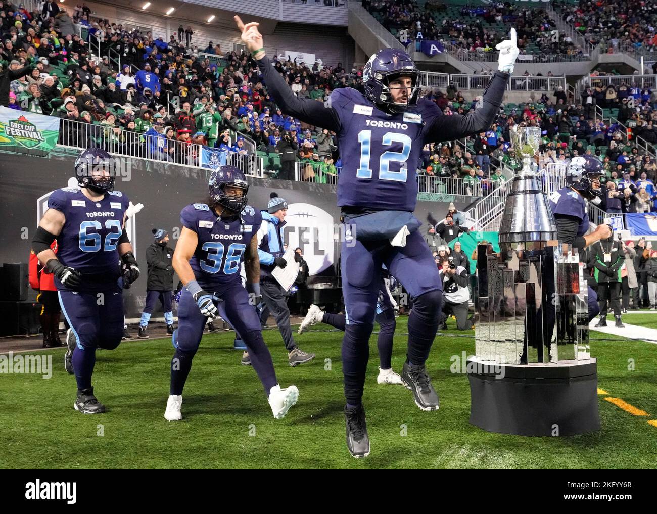 November 20, 2022, Regina, SK, Canada: Toronto Argonauts quarterback Chad  Kelly (12), fullback Declan Cross (38) and offensive lineman Ryan Hunter  (62) head out to the field in front of the Grey