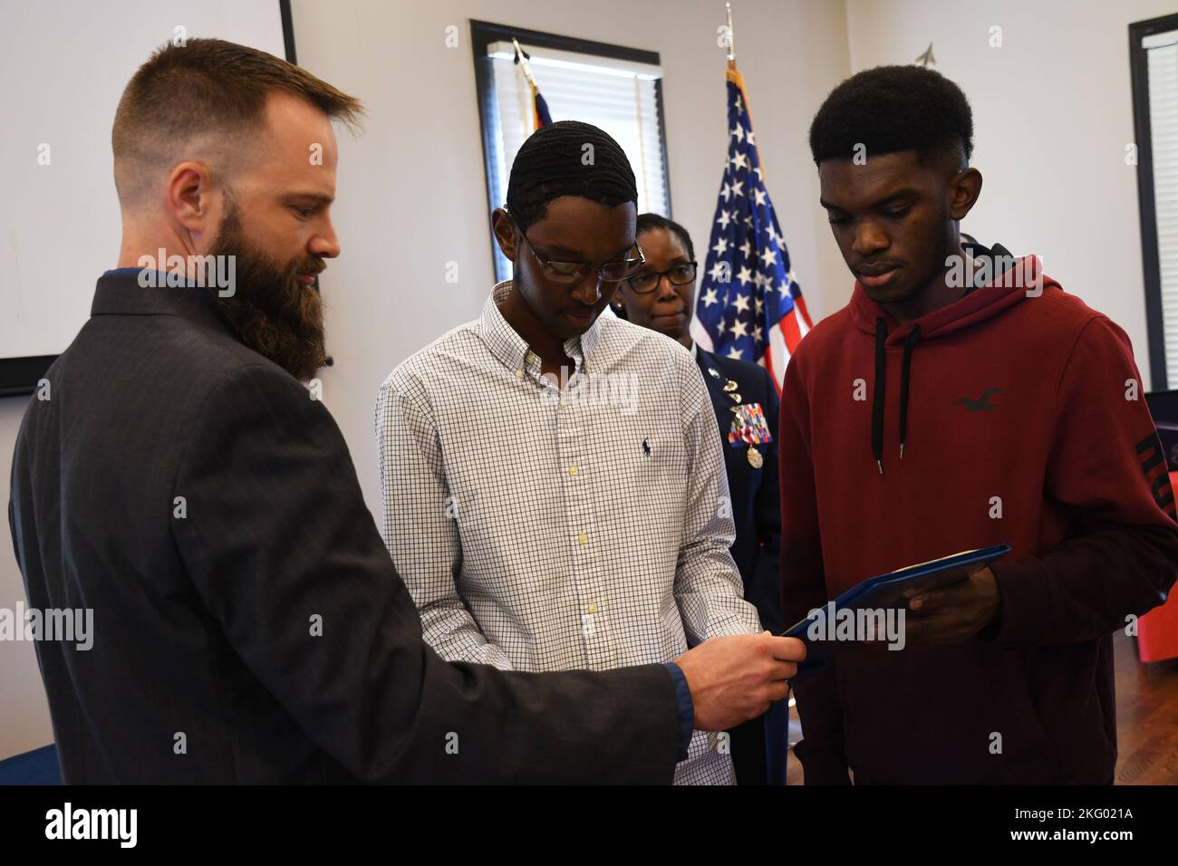 Master Sgt. Jacqueline Payne's children are presented with Certificates