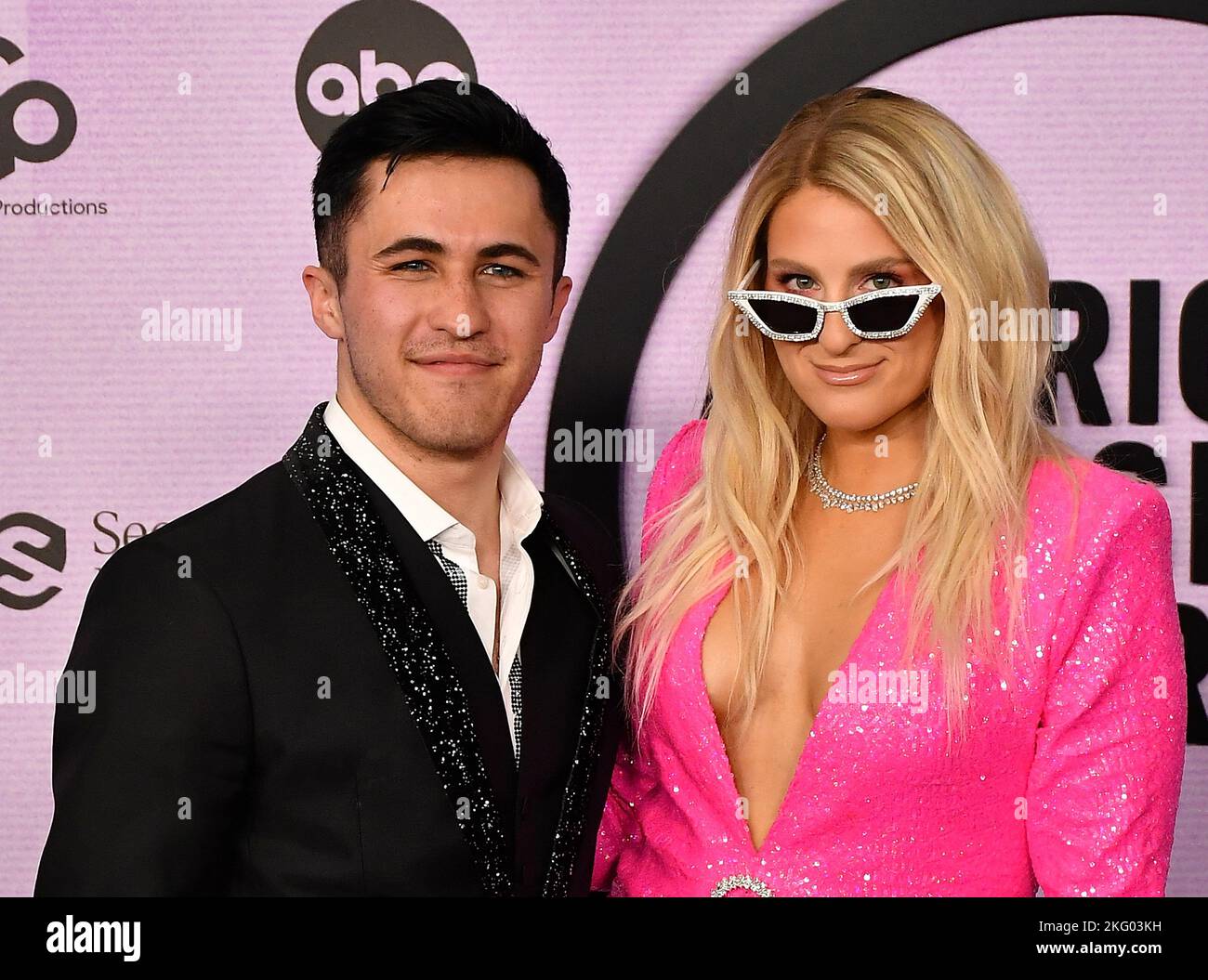 Chris Olsen and Meghan Trainor attend the 2022 American Music Awards at