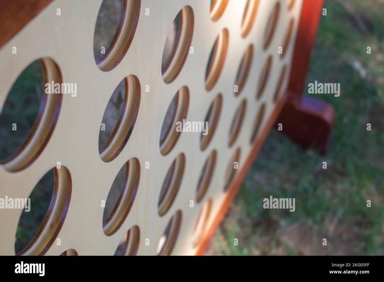 connect 4 vertical checkers game big and physical on lawn made of wood