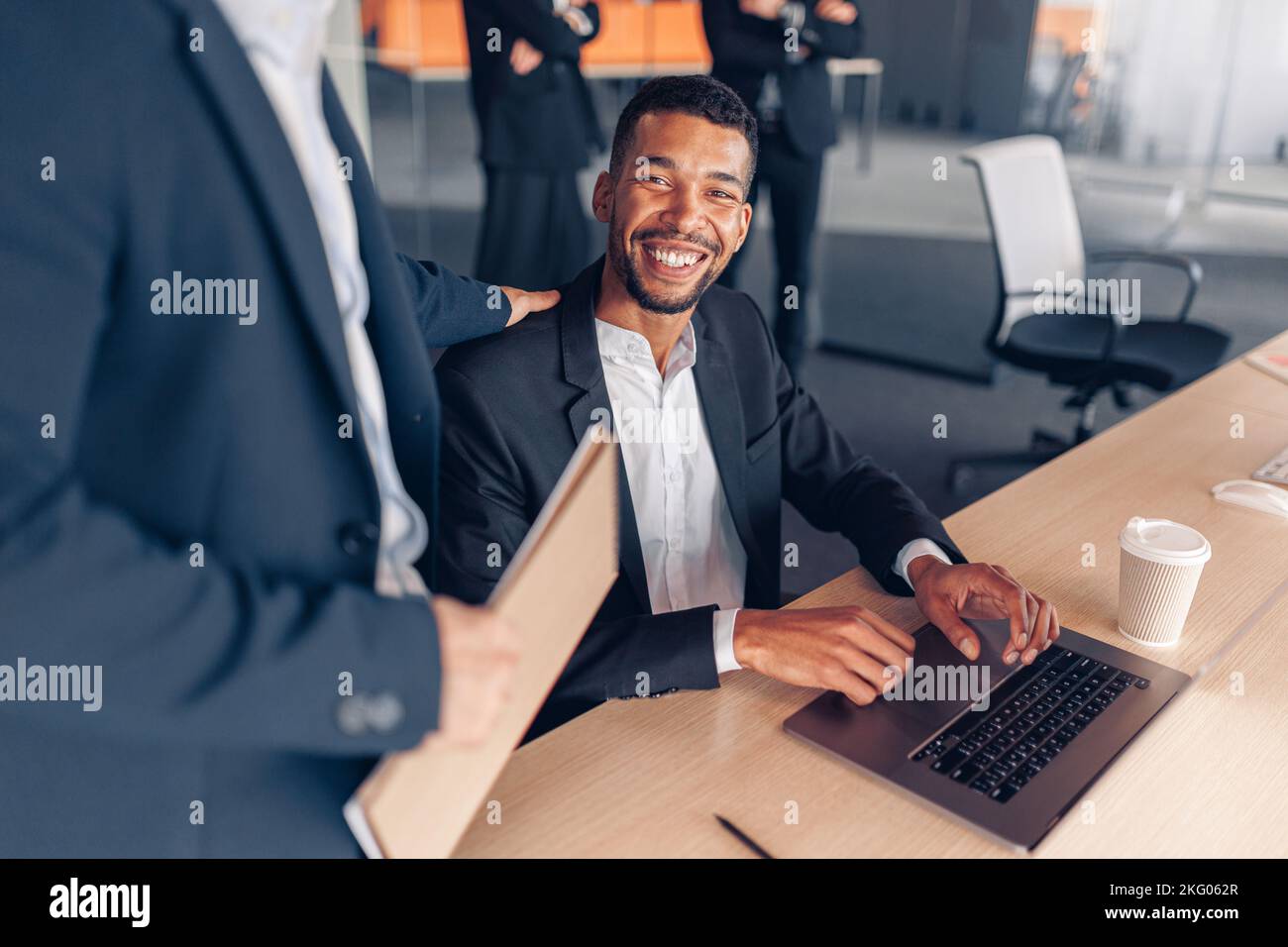 Two multiethnic colleagues working together on project in modern office Stock Photo