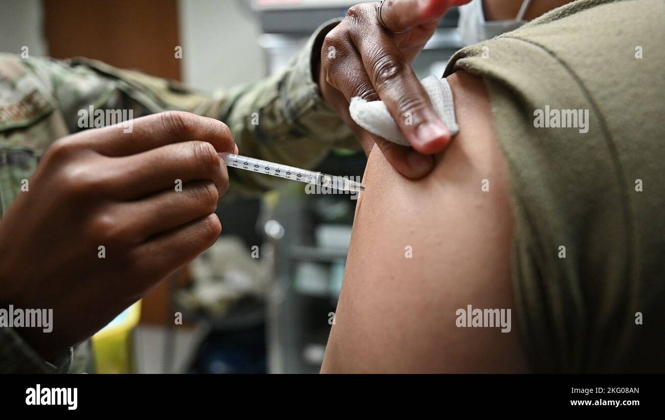 Master Sgt. Cherie Gregory, 66th Medical Squadron functional manager, administers a flu shot at Hanscom Air Force Base, Mass., Oct. 18. 66th Medical Squadron officials have begun administering flu vaccines on a walk-in basis to active duty members, first responders here, as well as high-risk TRICARE beneficiaries. Stock Photo
