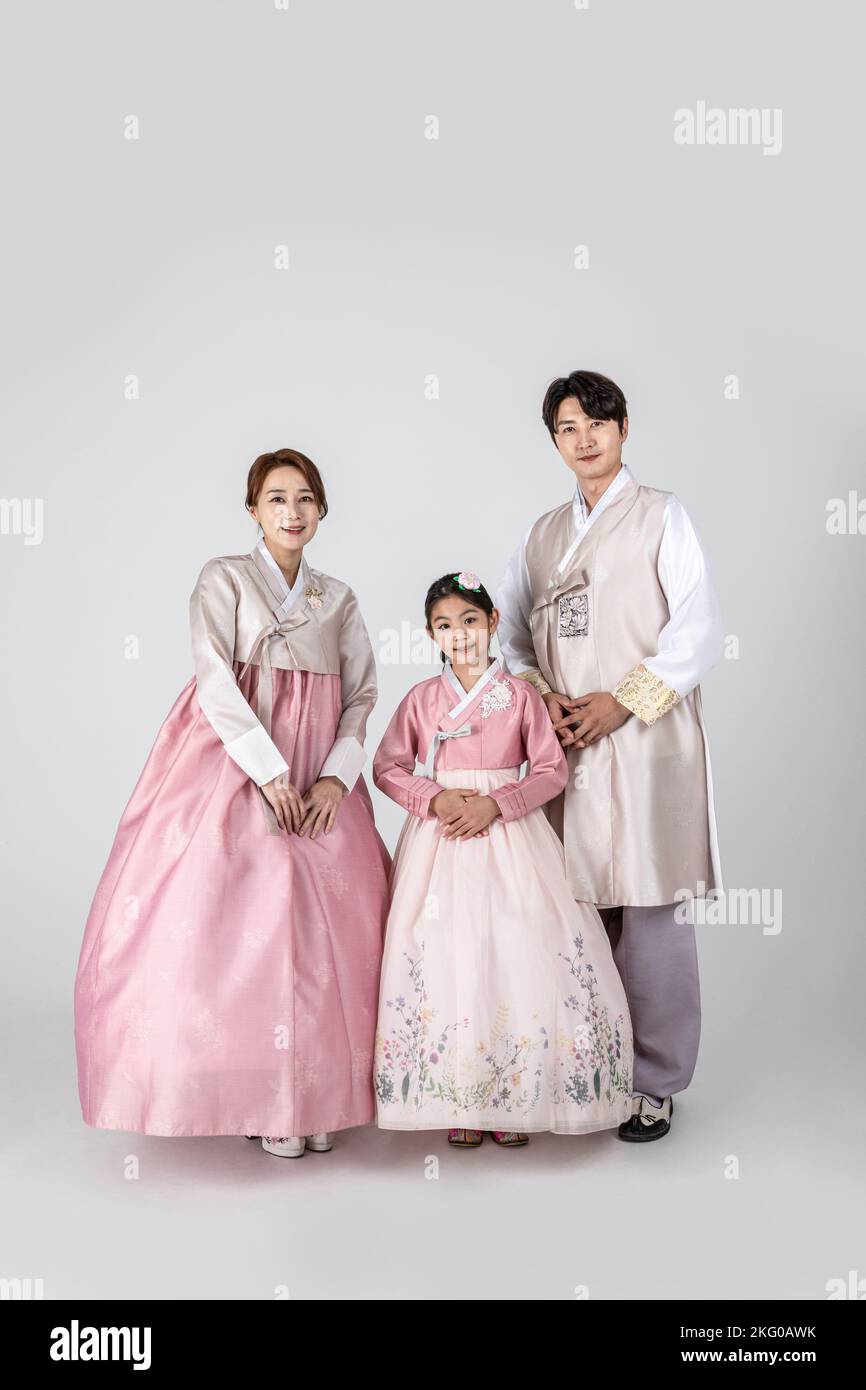 Korean family in Hanbok, isolated white background standing friendly ...
