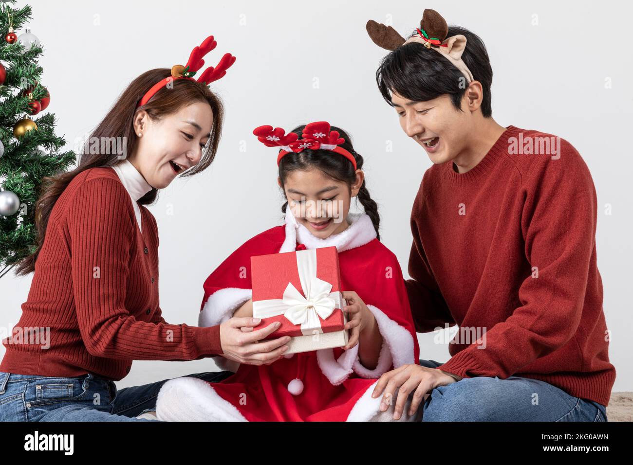 happy Asian Korean family in Christmas concept holding a gift box Stock ...