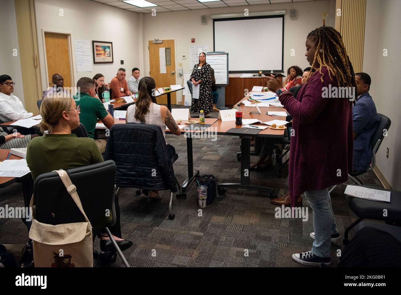 Roshanda McGrew (standing farright), Housing Personnel