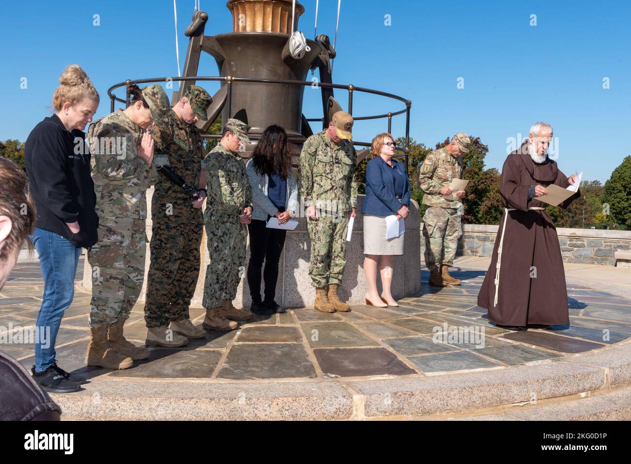 Walter Reed National Military Medical Center’s facility dogs along with the Red Cross volunteer and patient service dogs (and their handlers and owners), assembled at the flagpole in front of Building 1 (The Tower) for the annual Blessing of the Dogs Ceremony on Oct. 18. This marks the 16th year that this ceremony has taken place at WRNMMC.    Officiating at this year’s ceremony were Chaplains Brother David W. Schlatter, and Army Maj. Robert W. Fry, both from the Department of Pastoral Care at WRNMMC.    The ceremony is associated with Saint Francis of Assisi, whose patronage of animals and th Stock Photo