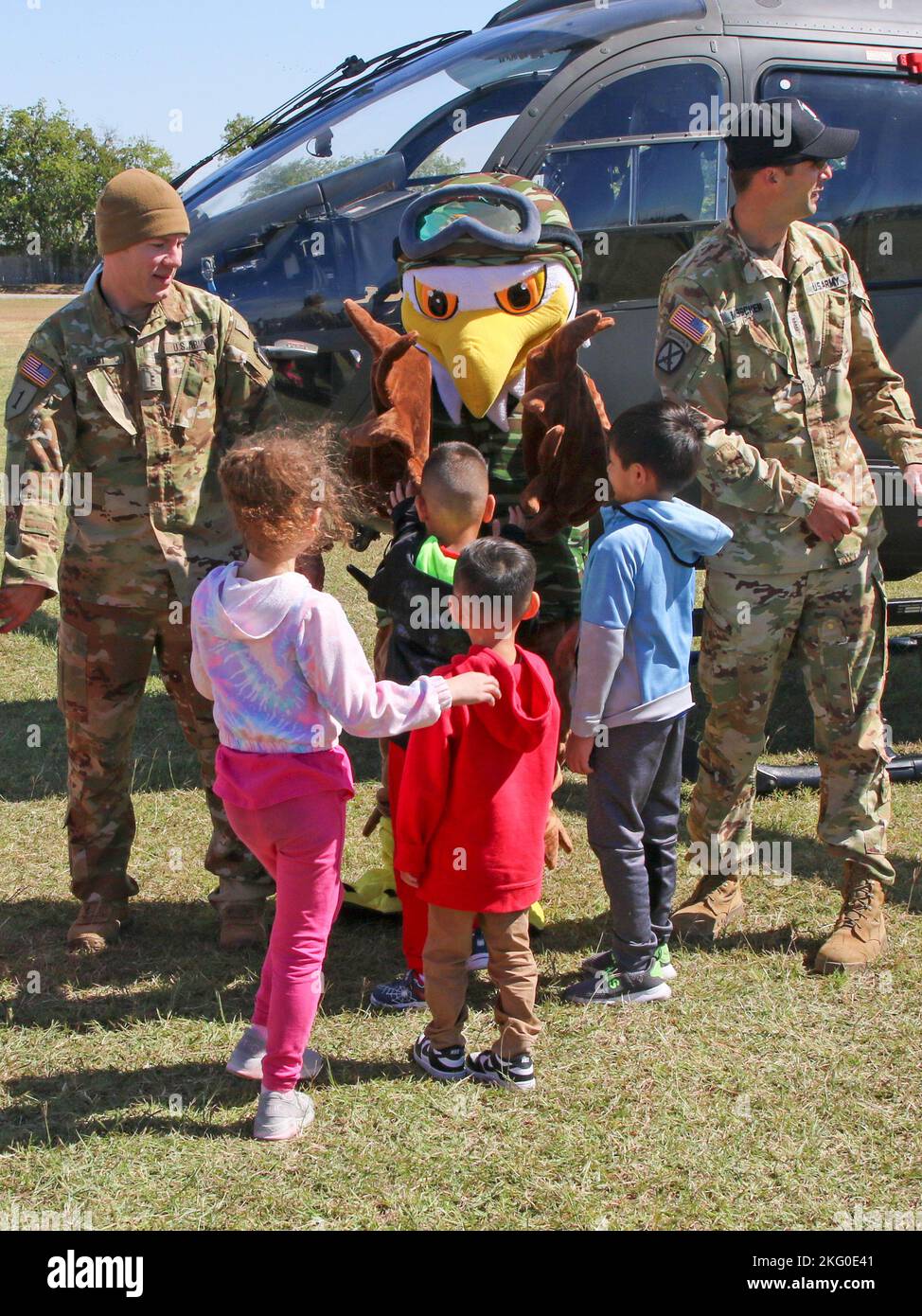 AUSTIN, Texas —A special agent from the U.S. Drug Enforcement Administration speaks with children at Cottonwood Creek Elementary School Oct. 18, 2022, in Hutto, Texas, with support from the Texas National Guard Joint Counterdrug Task Force who brought a LUH-72 Lakota helicopter and their mascot, “Enney the Eagle,” to visit the school during Red Ribbon week activities. Every year, the Texas Counterdrug program supports DEA’s Red Ribbon awareness and prevention activities at schools around the state. Stock Photo