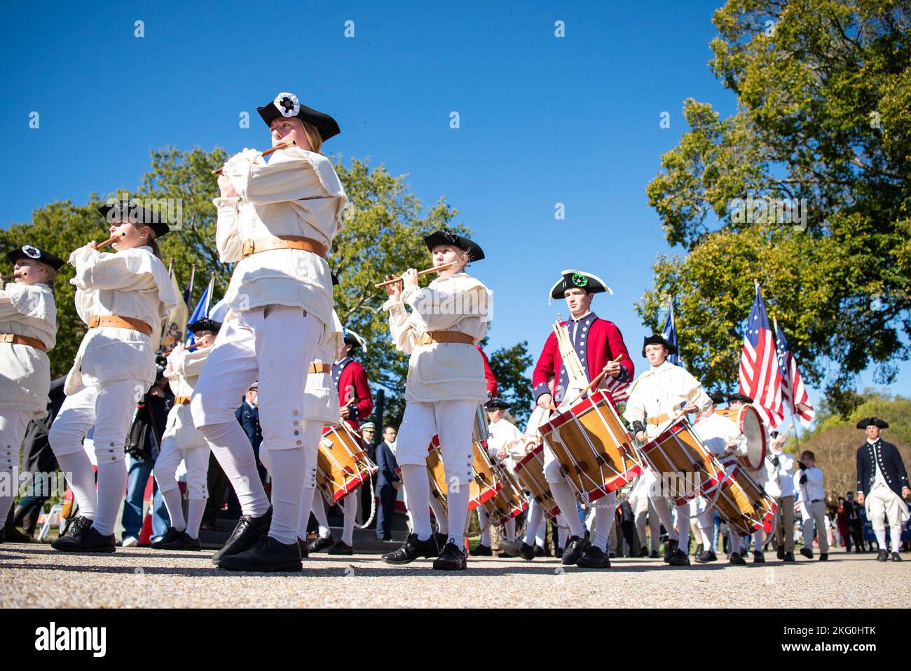 A fifes and drums unit march in formation during the Yorktown Day