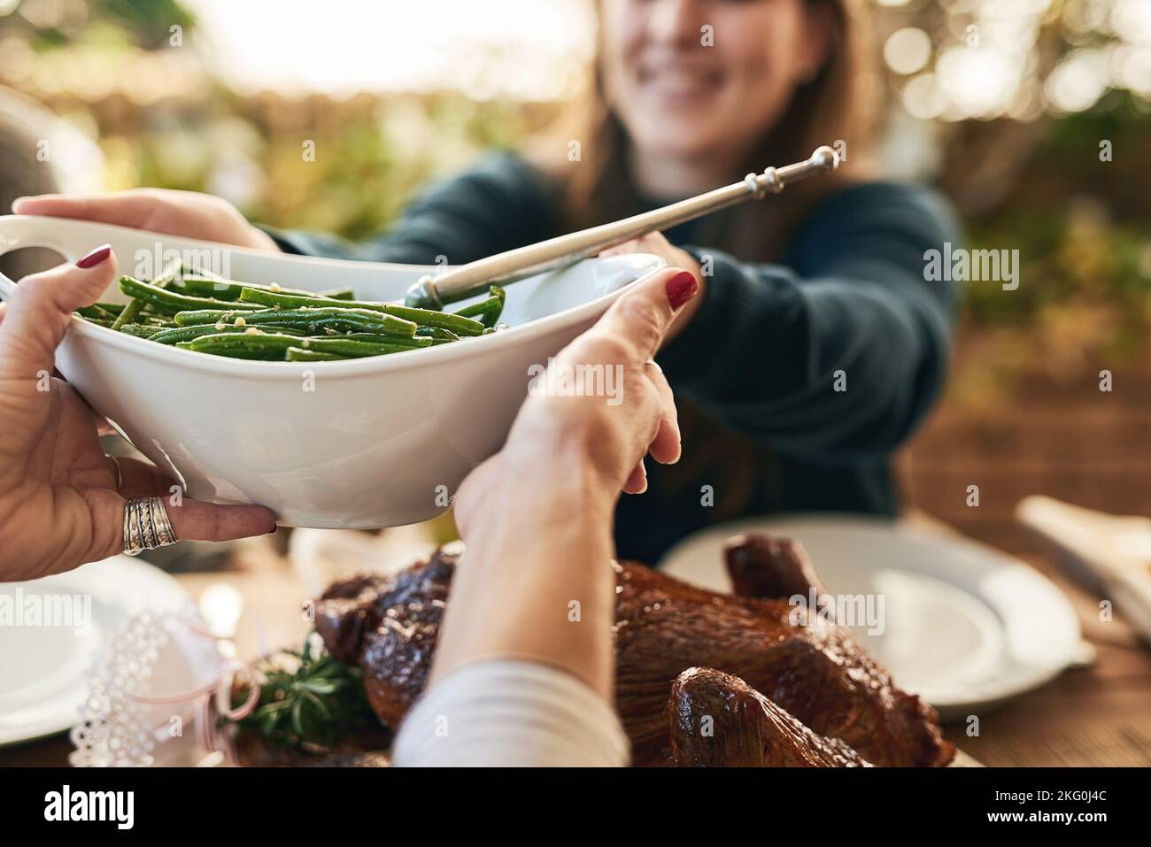 Food, hands and couple share healthy vegetables at dining room table