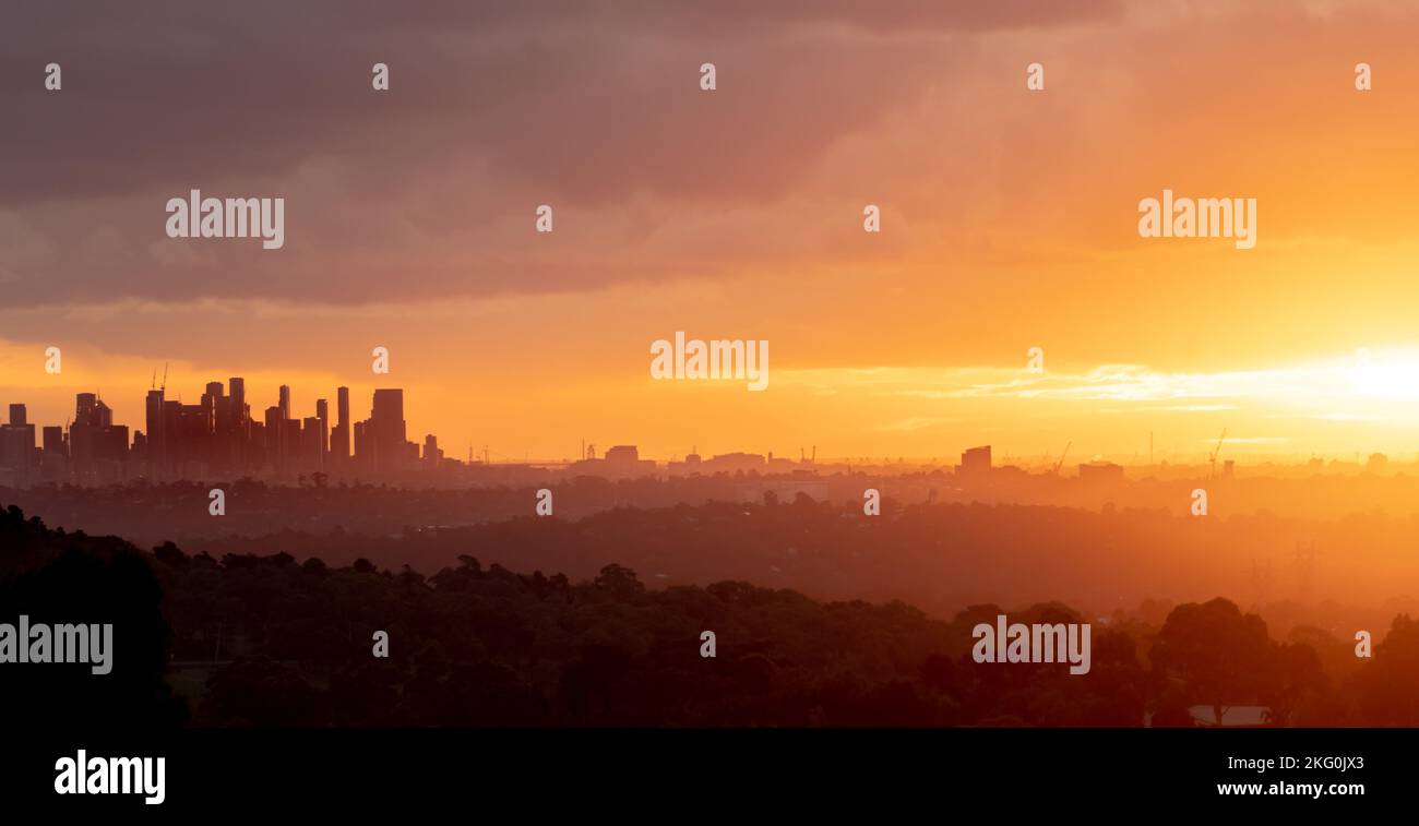 View from Garden Hill in Kangaroo Ground, Victoria, Australia of the Melbourne city skyline at sunset Stock Photo