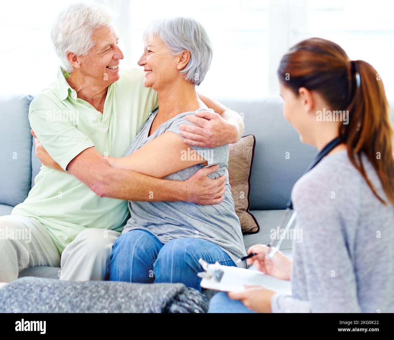 Its going to be okay now. A doctor explaining positive test results to an overjoyed senior patient and her husband. Stock Photo