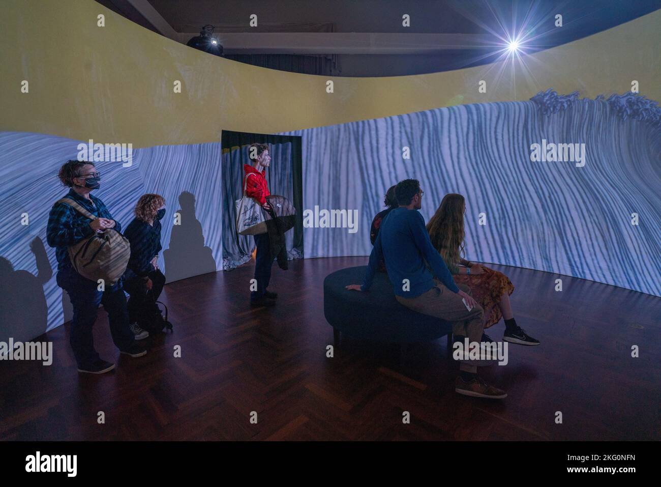 Adelaide, Australia. 21 November 2022.  Visitors take part in an immersive 360-degree installation  from sea to sky created by Gerry Wedd which unites digital imagery, ceramics and sound and offers a powerful commentary about the human impact upon the natural world,. Credit: amer ghazzal/Alamy Live News Stock Photo