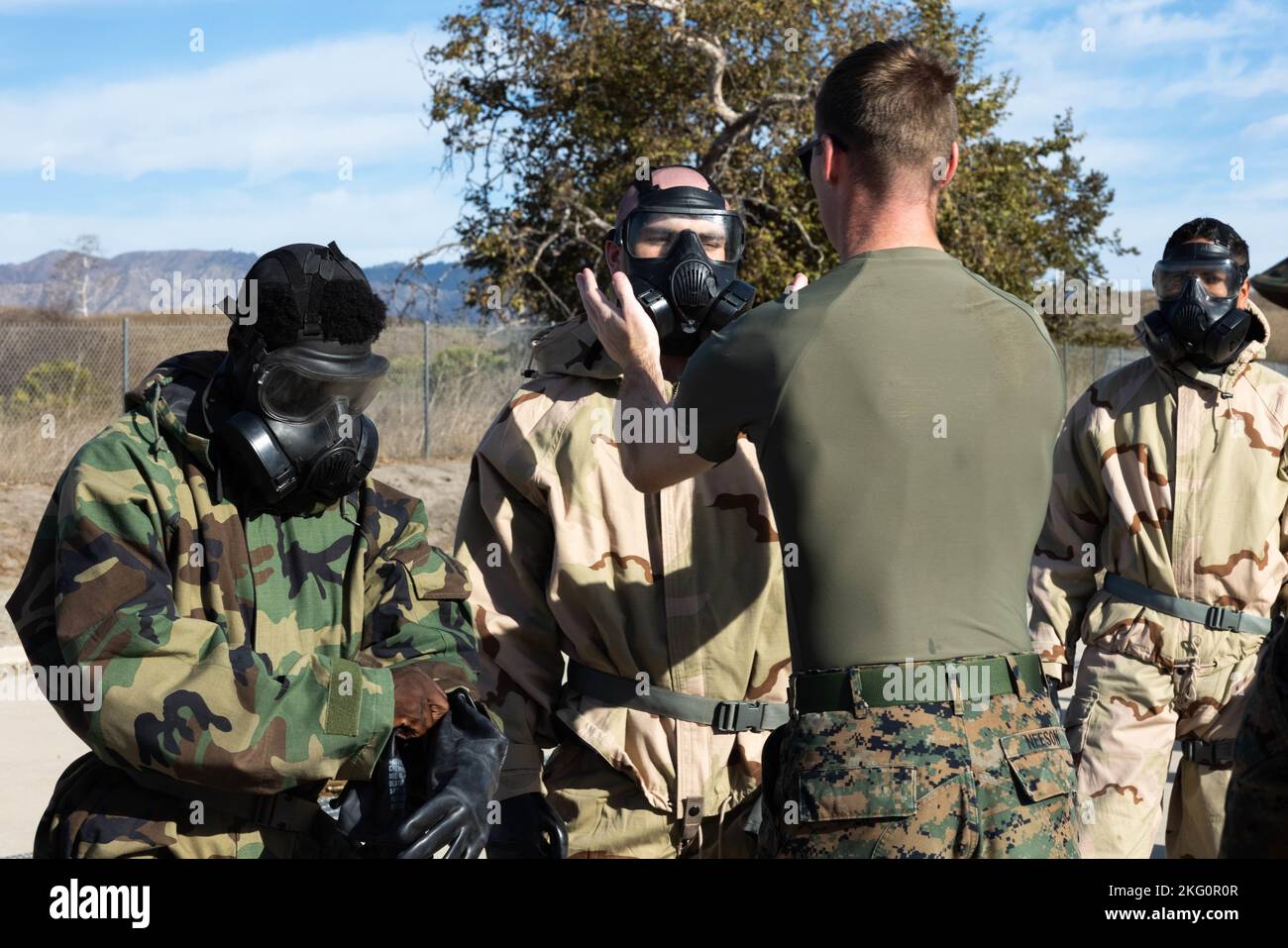 U.S. Marine Cpl. Brendan F. Neeson, a chemical, biological, radiological and nuclear defense specialist with I Marine Expeditionary Force, checks Marines’ M50 gas masks during CBRN training at Marine Corps Base Camp Pendleton, California, Oct. 20, 2022. CBRN training is conducted annually to ensure Marines know how to use their protective gear in the event of a chemical attack. Stock Photo