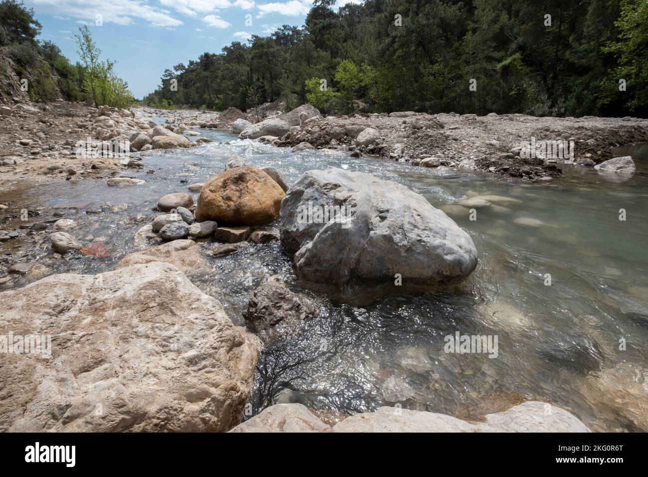 mountain riverbed full of big stones by springtime in Turkey Stock Photo