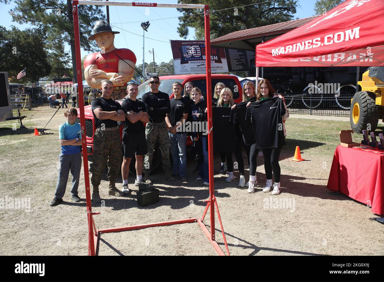 U.S. Marines, with Recruiting Station Baton Rouge, pose with players