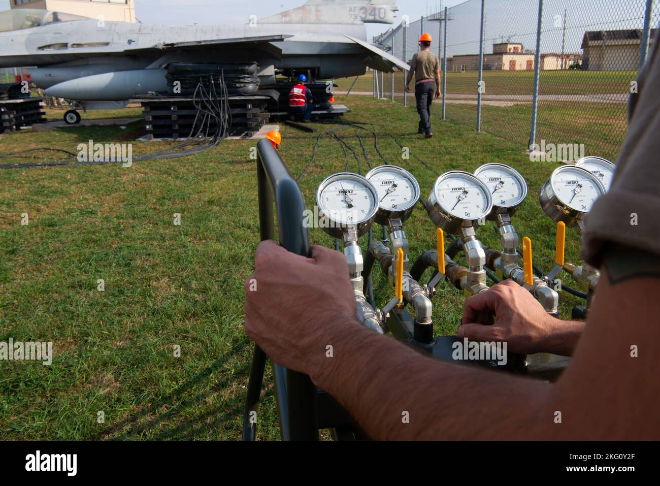 Fighter Plane Inflation U.S. Air Force Airman uses an inflation console for a bag lift during a ...