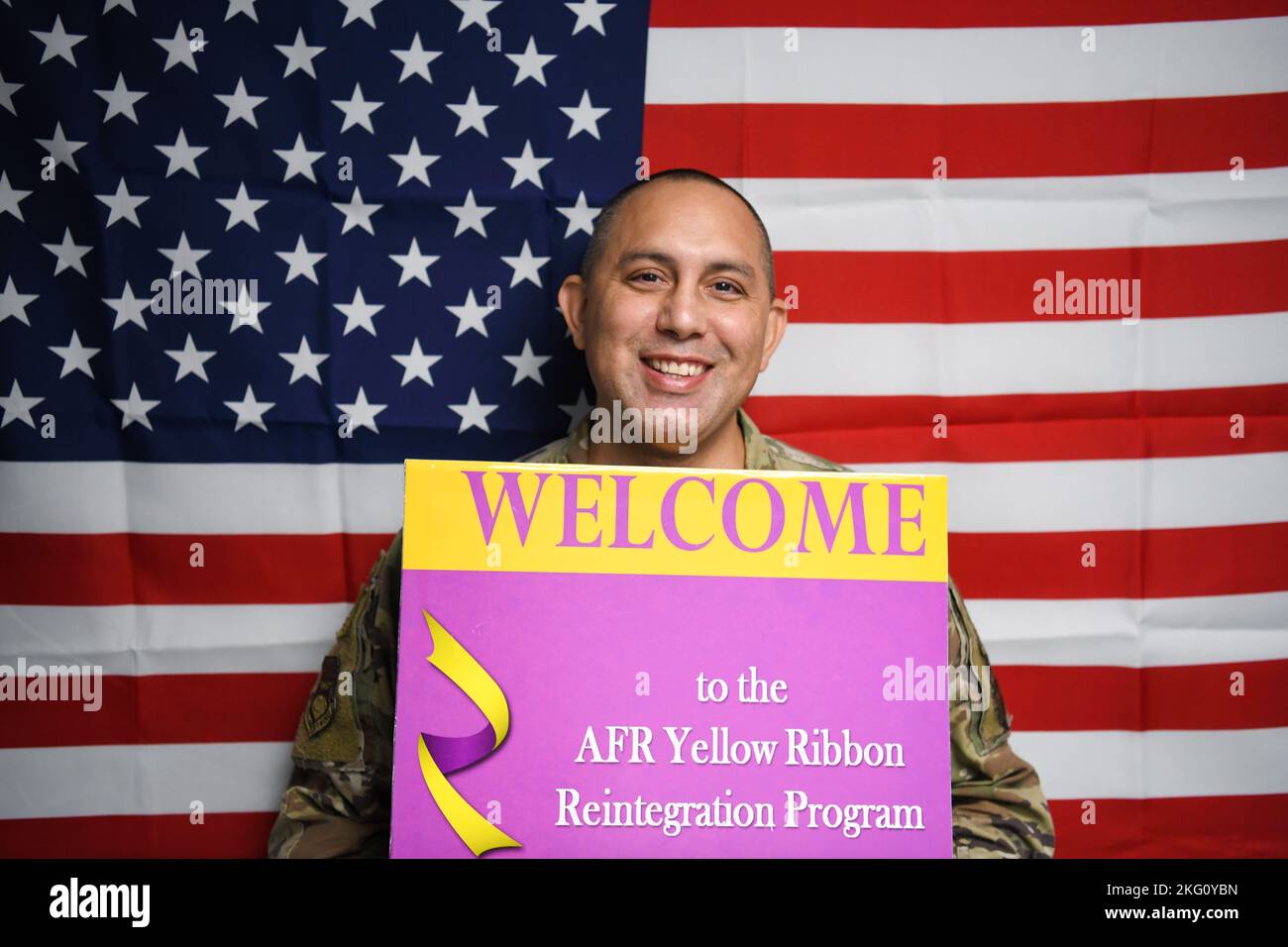 Master Sgt. William Bonner, 433rd Airlift Wing and 960th Cyberspace Wing Yellow Ribbon Program representative, holds a welcome sign for all current and future deployers to contact him about the Air Force Reserve Program Oct. 20, 2022, at Joint Base San Antonio-Lackland, Texas. Stock Photo