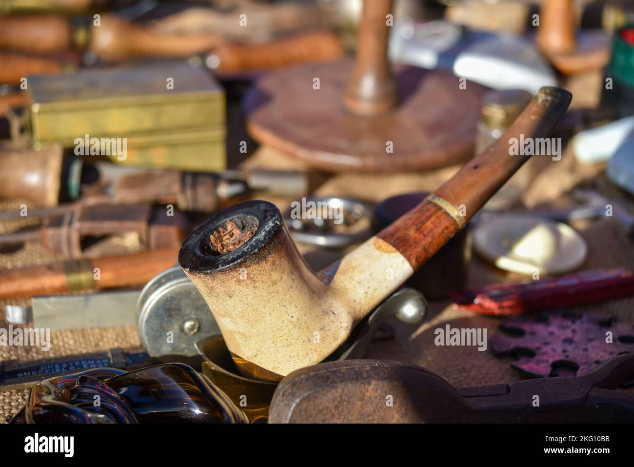 Old style pipe, possibly Victorian, on display at a market Stock Photo