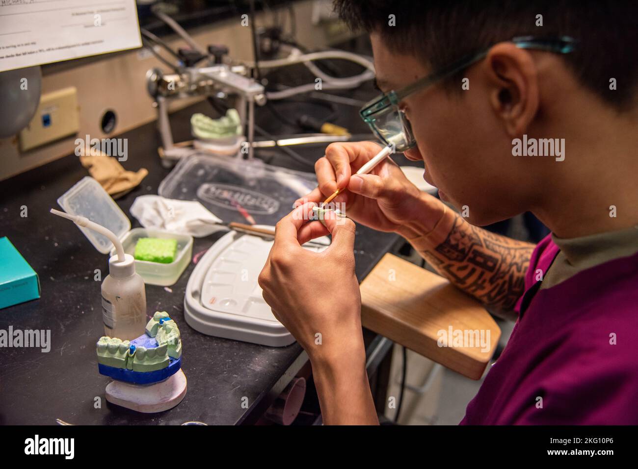 Students fabricate dental appliances during classes at the Medical Education and Training Center (METC), Joint Base San Antonio-Fort Sam Houston, Texas, October 20, 2022. The METC on Joint Base San Antonio-Fort Sam Houston, Texas, trains enlisted medical professionals in the Army, Navy, Air Force, and Coast Guard. One of METC’s 48 programs of instruction is the multi-service Dental Laboratory Technology program in which Army, Navy, and Air Force students learn how to fabricate complete dentures, Removable Partial Dentures (RPD) and treatment appliances, crowns and bridges, metal-ceramic restor Stock Photo