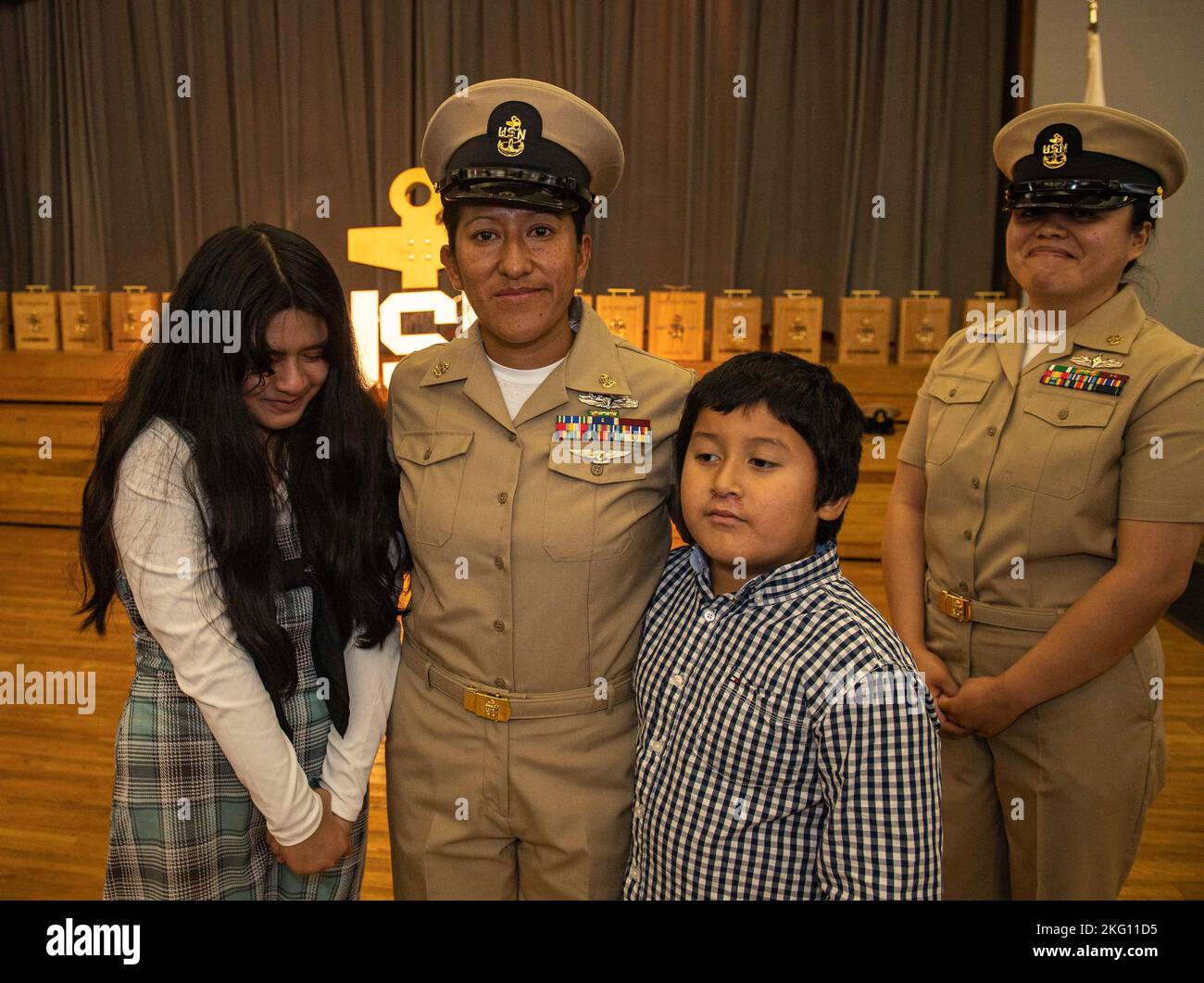 Chief Machinist’s Mate Elizabeth Valdez, assigned to U.S. Naval Ship Repair Facility Detachment Sasebo, poses for a photo during a chief petty officer pinning ceremony at Commander, Fleet Activities Sasebo Oct. 21, 2022. The rank of chief petty officer was created April 1, 1893, and the chief petty officer pinning ceremony is a unique tradition to the U.S. Navy that signifies promotion to a crucial position of leadership and responsibility. Stock Photo