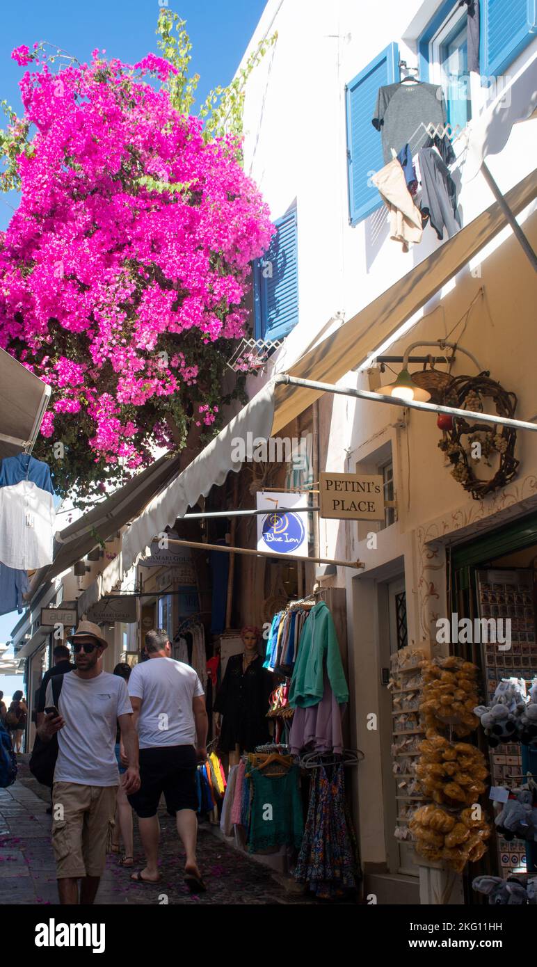 Fira santorini Greece -22 September 2022: Narrow street in Fira Santorini with Tourists Stock Photo
