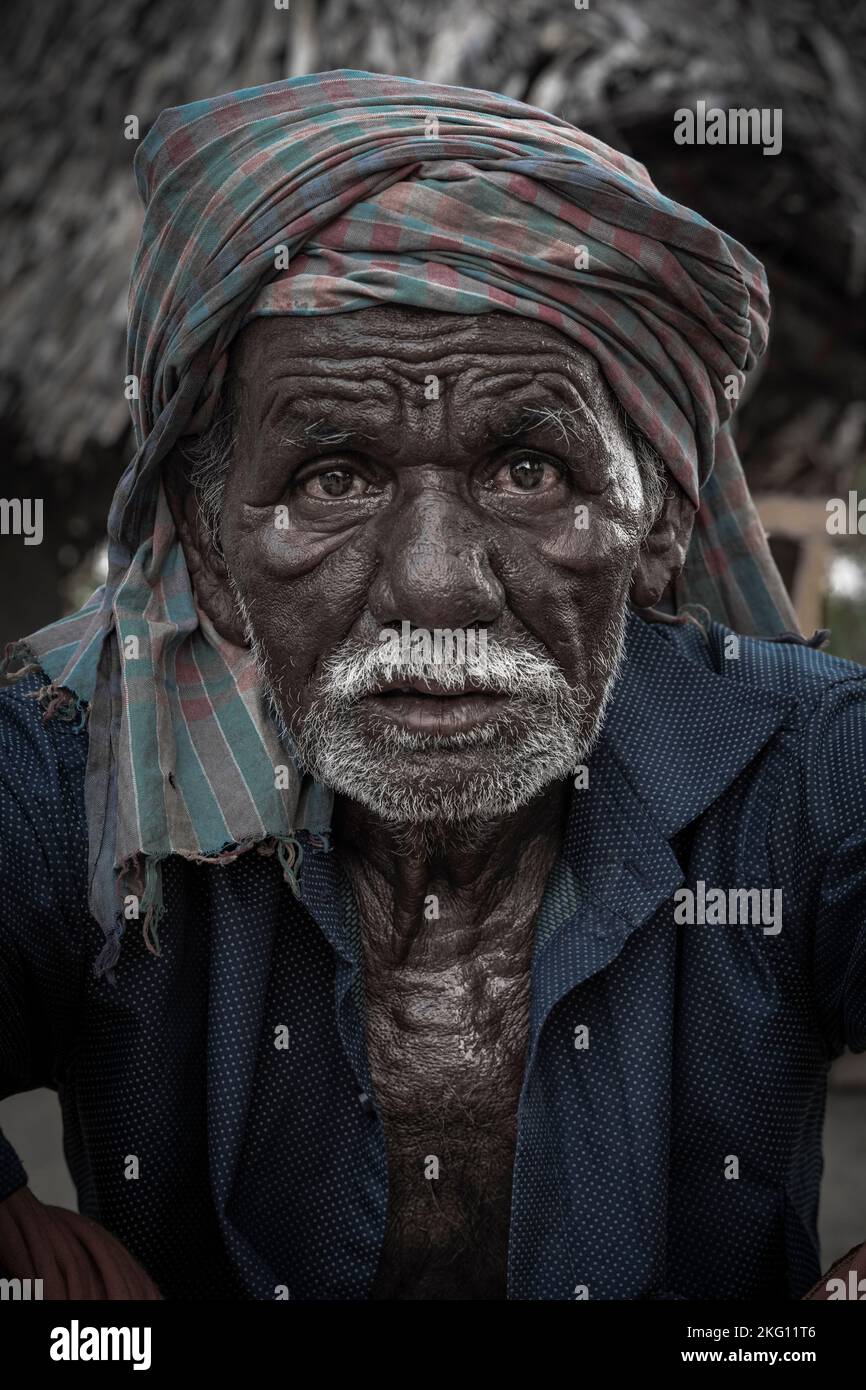 A vertical portrait of an old tribal man in details Stock Photo - Alamy