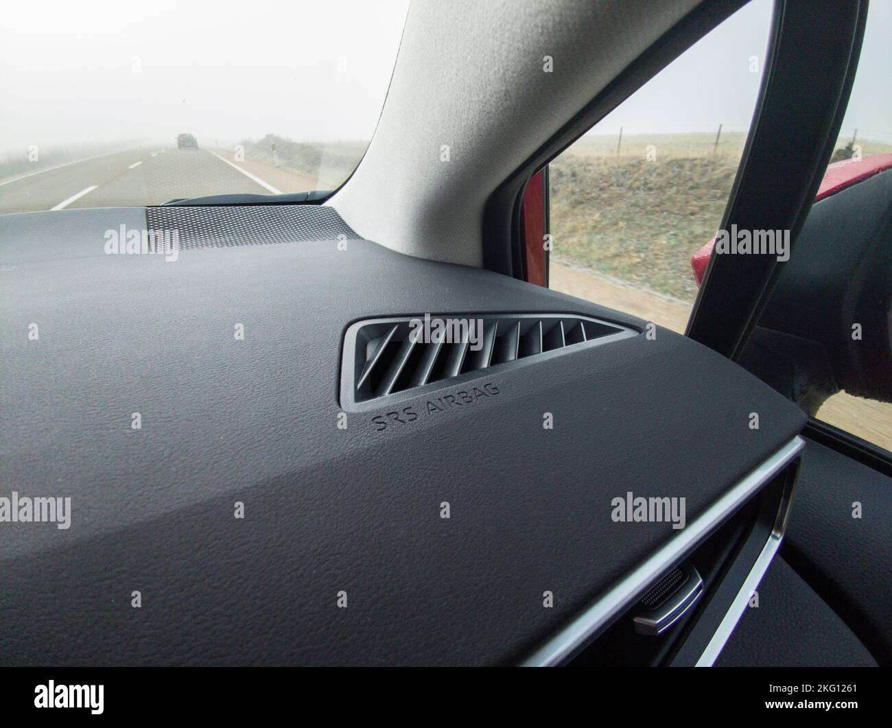 Car equipped with SRS airbag system. Driving by local road with dense fog Stock Photo
