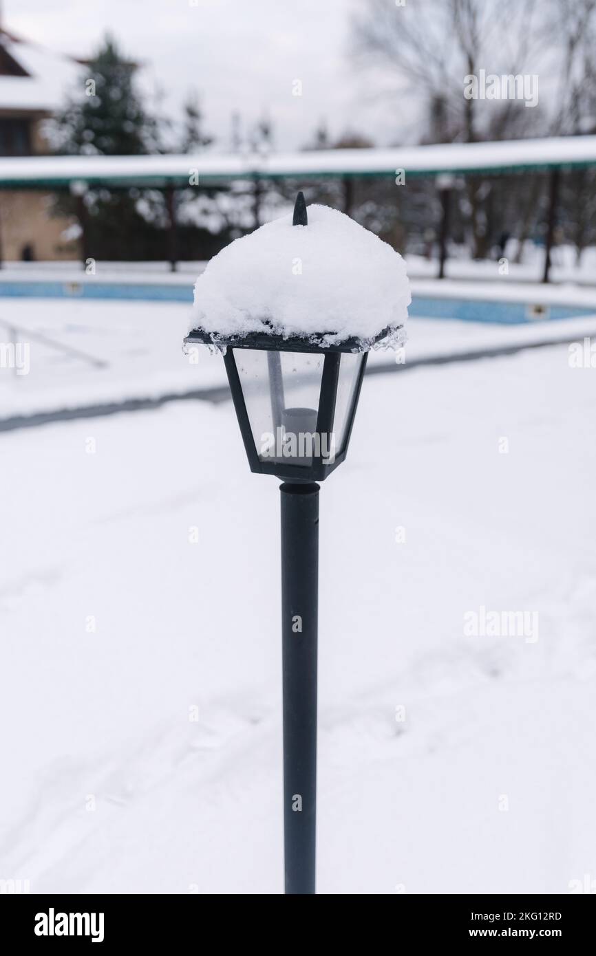 Street lamp covered with snow. Winter weather Stock Photo - Alamy