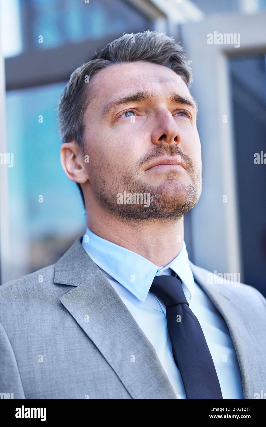 Setting his sights on success. Head and shoulders shot of a serious-looking businessman standing outside. Stock Photo