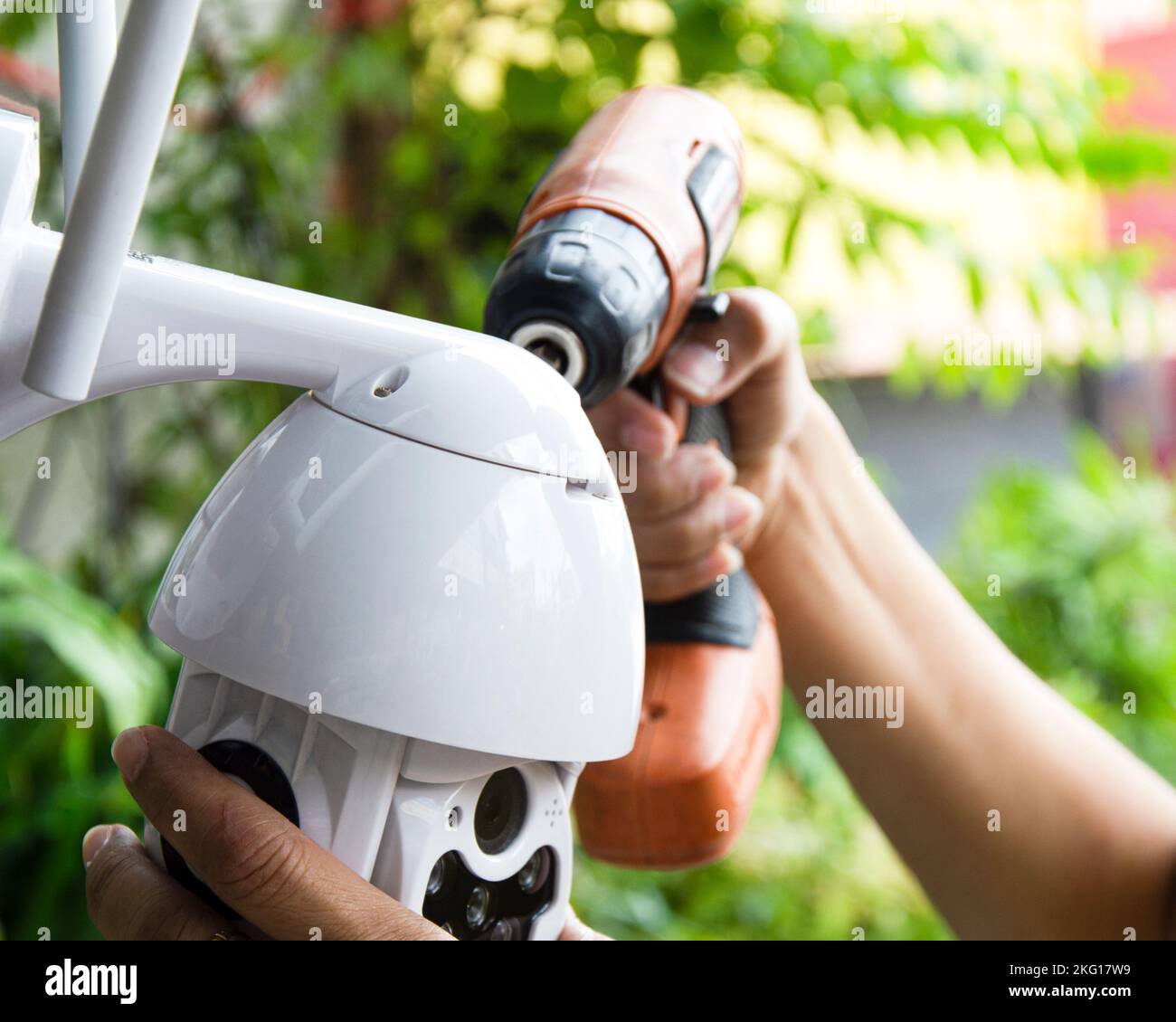 Man installing IP CCTV or high tech surveillance system CCTV system Stock Photo