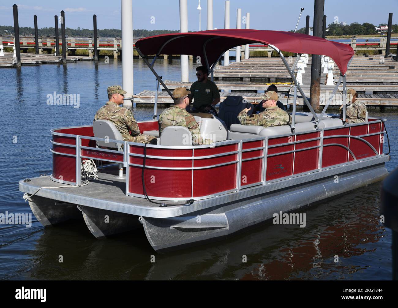 Keesler personnel take a pontoon boat ride during the fuel pier ribbon