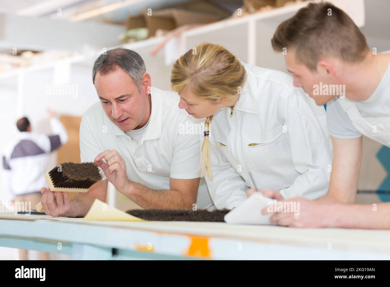 young apprentices learning to paint Stock Photo