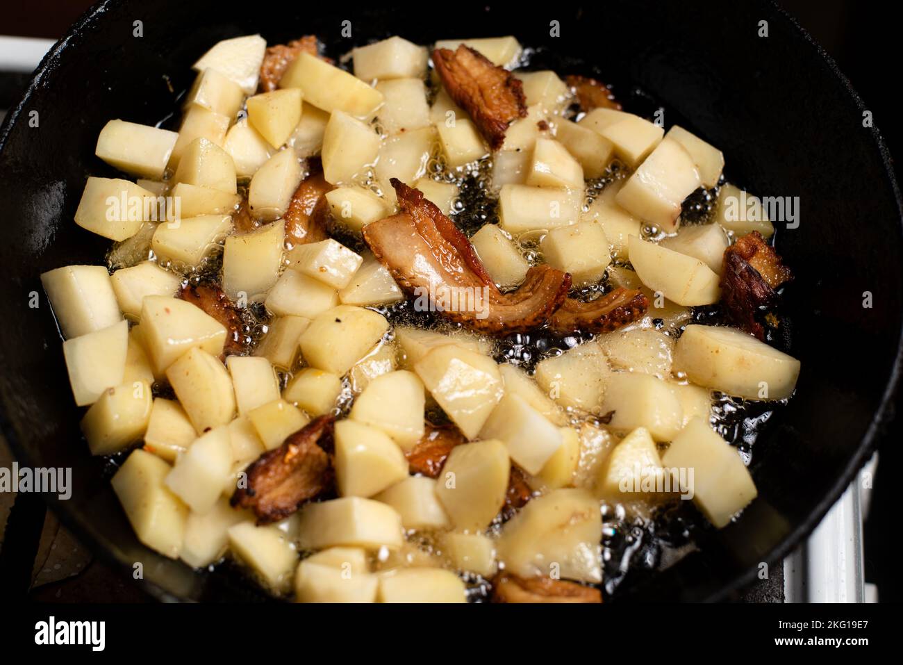 Cooking fried potatoes with lard, cracklings in a pan Stock Photo Alamy