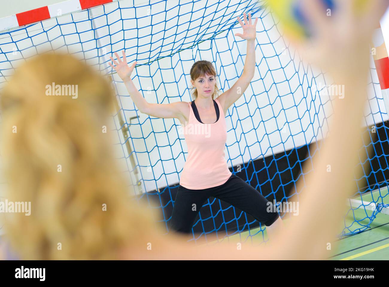 portrait of women playing handball Stock Photo