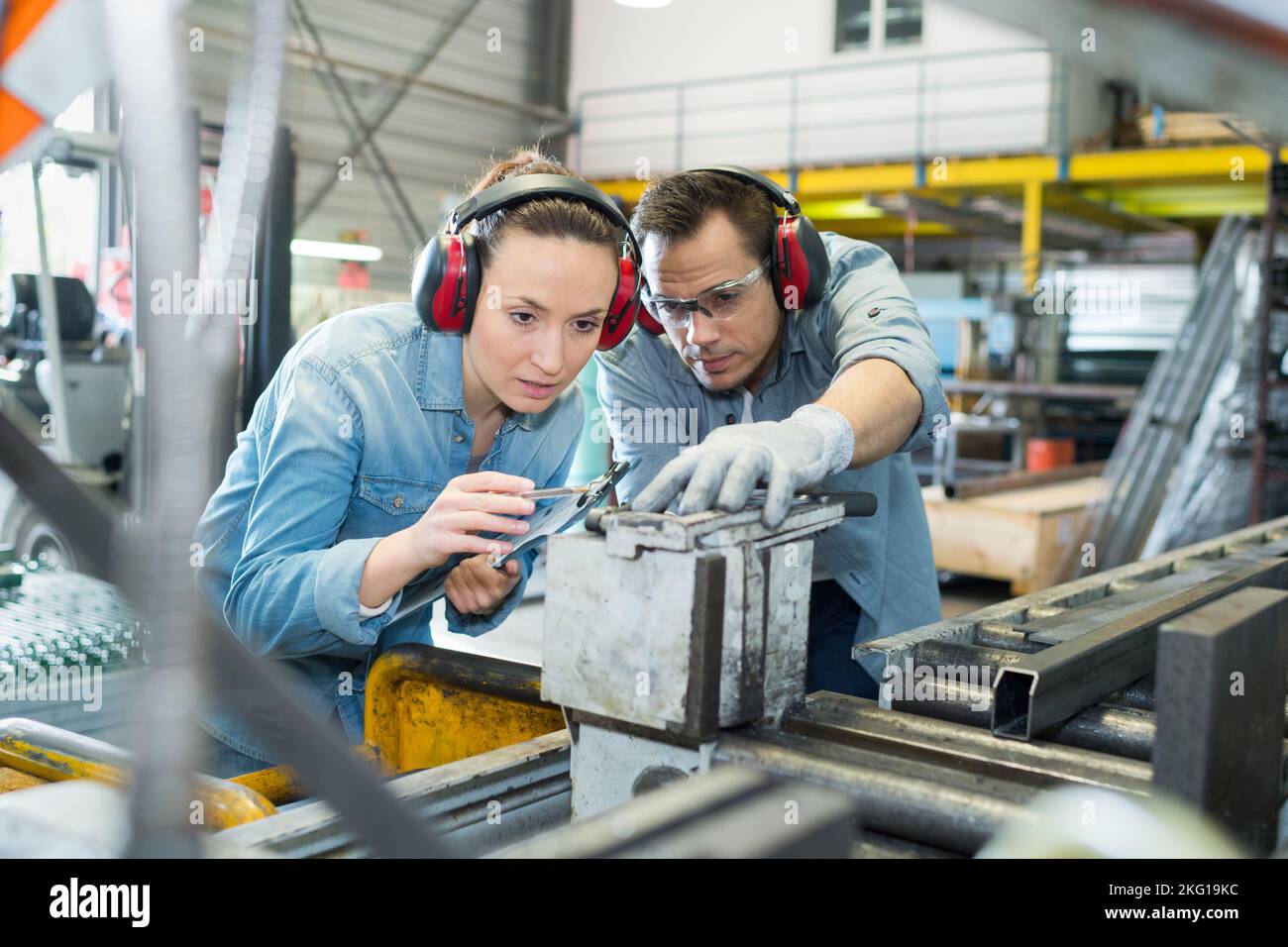 worker explaining how the machine works Stock Photo Alamy