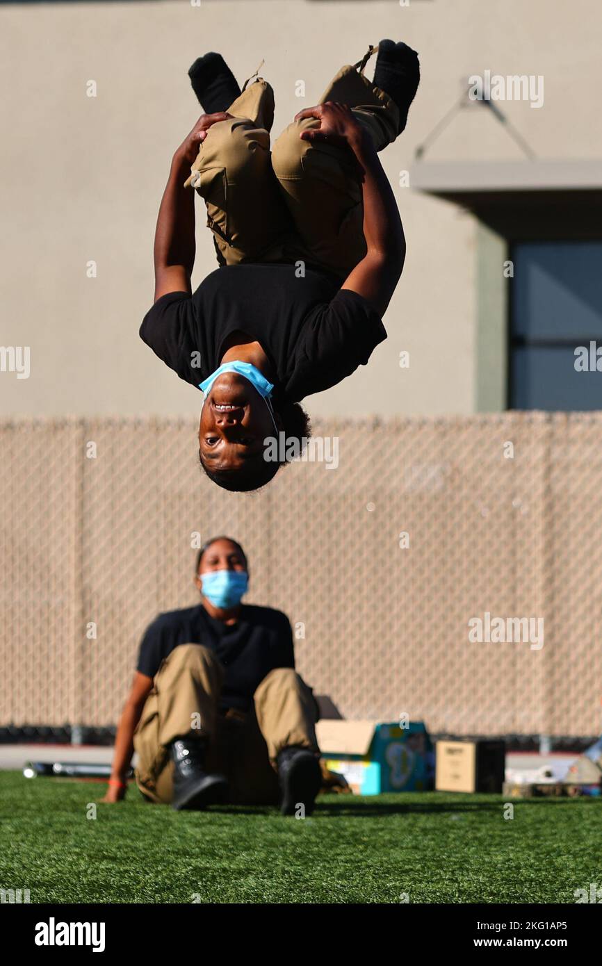 Sunburst Youth Challenge Academy Class 30 Cadet Keezshanae Porter backflips as part of a hip-hop dance during a Beats Lyrics Leaders performance showcase, Oct. 21, 2022, at Joint Forces Training Base, Los Alamitos, California. Cadets spent the week immersed in arts education with visual art, music and dance mentors from Beats Lyrics Leaders. The program aimed to open students to the arts as a coping mechanism and path to self expression. Sunburst is a high school credit recovery program run in partnership between the California National Guard’s Task Force Torch youth and community programs dir Stock Photo