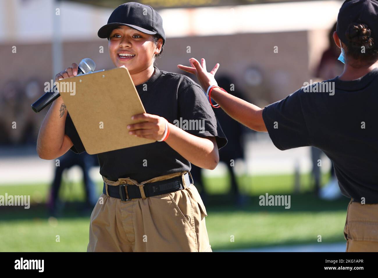 Sunburst Youth Challenge Academy Class 30 Cadet Briana Perez raps her own lyrics from a sheet of paper on a clipboard during a Beats Lyrics Leaders performance showcase, Oct. 21, 2022, at Joint Forces Training Base, Los Alamitos, California. Cadets spent the week immersed in arts education with visual art, music and dance mentors from Beats Lyrics Leaders. The program aimed to open students to the arts as a coping mechanism and path to self expression. Sunburst is a high school credit recovery program run in partnership between the California National Guard’s Task Force Torch youth and communi Stock Photo