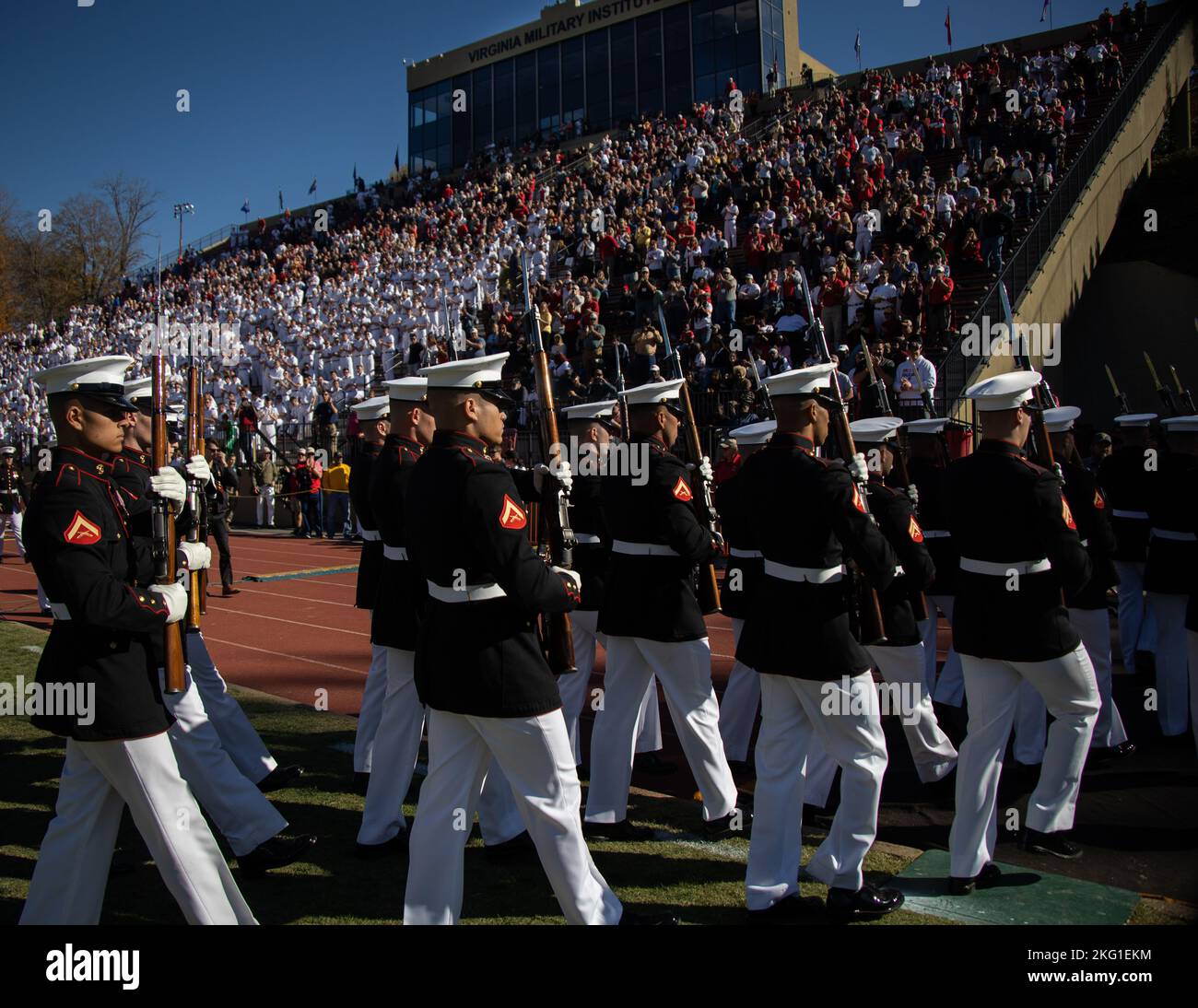 Marines with “The Silent Drill Platoon,” Marine Barracks Washington, march off the field after their performance during a Virginia Military Institute football game at Lexington, Va., Oct 22, 2022. The Marines performed for thousands of cadets and family members attending the game, demonstrating the professionalism of the United States Marine Corps. Stock Photo