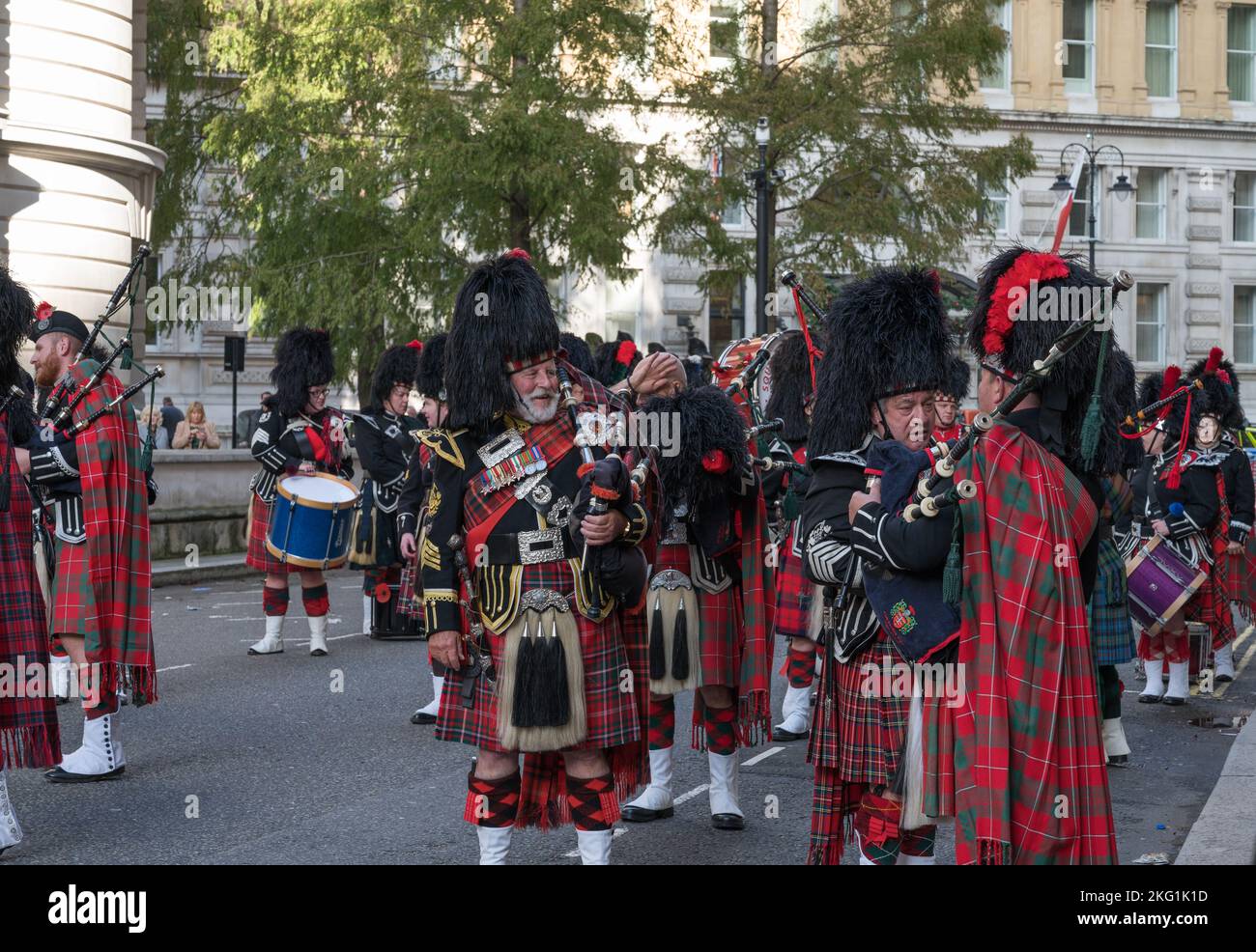 Southern Highlanders Pipes & Drums band gathered on Whitehall Court preparing to lead the annual war widows parade. London, England, UK Stock Photo