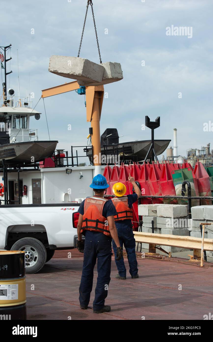 Coast Guard Cutter Patoka crew loads cement weights on Coast Guard