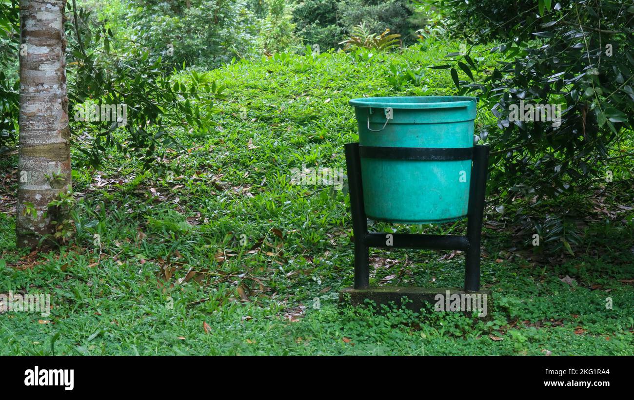 green trash bins in tourist spots Stock Photo - Alamy