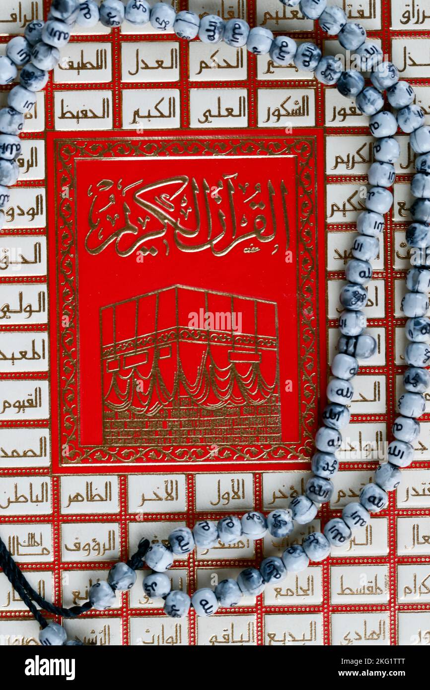 Holy Quran in Arabic and muslim prayer beads. Islam symbols Stock Photo