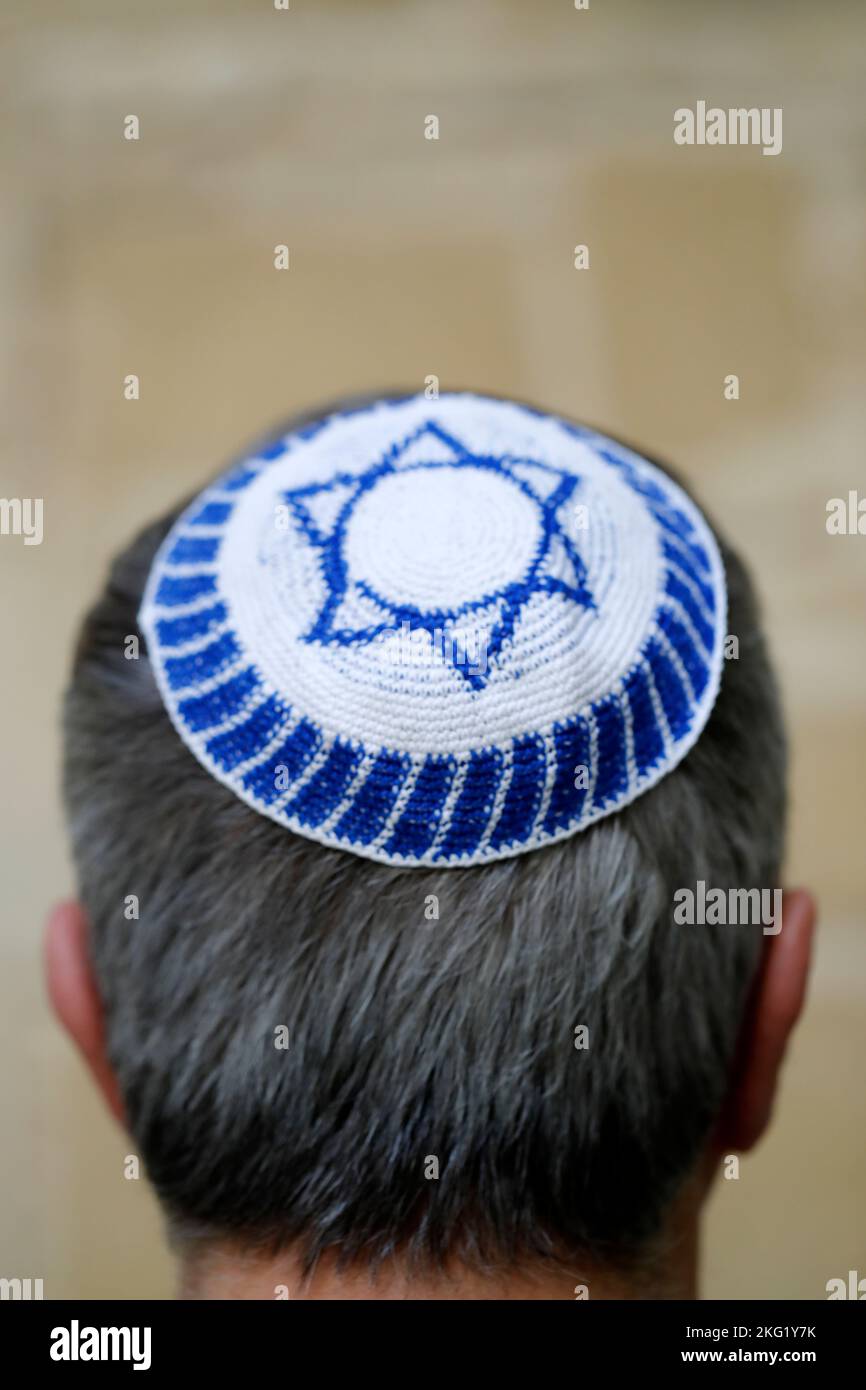 Back view of a man wearing a kippa which shows the star of David on the top. Jewish symbol. Stock Photo